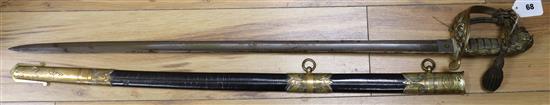 A Whiteman & Woolwich Outfitter's Naval sword and bi-corn with box sword 94cm